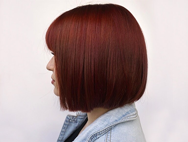 UGC image from Instagram, @avedaartists - redheaded bob haircut.